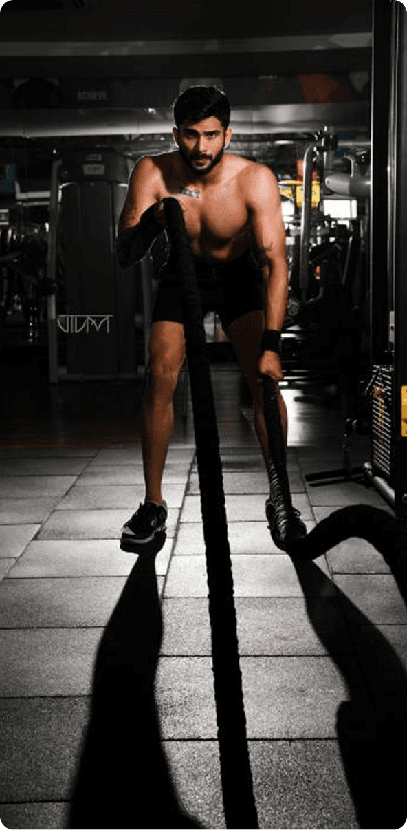 Phoenix Fitness athlete performing battle ropes workout